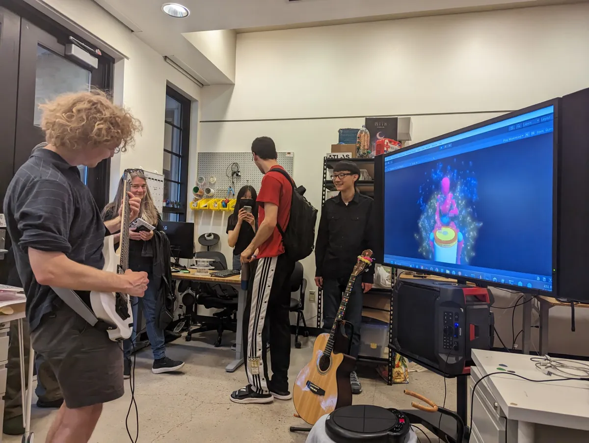 Exhibition visitors jamming with the virtual AI drummer.
