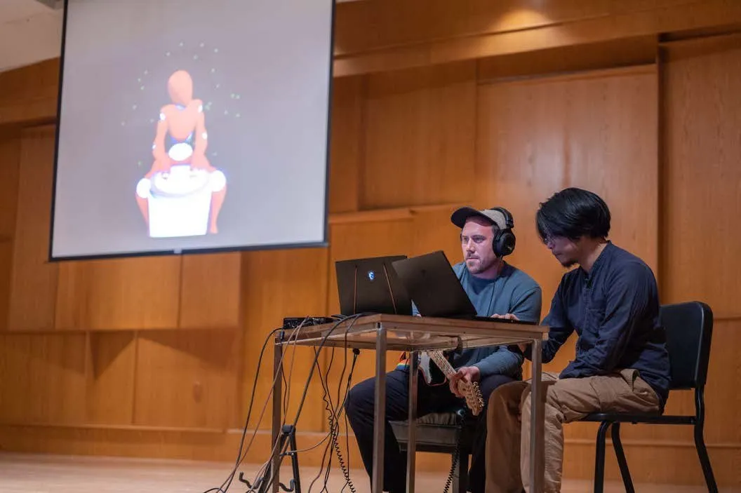 Grusin Music Hall, CU Boulder, with the virtual AI drummer projected on screen.